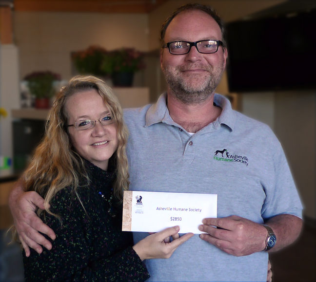 Amy White Presents Check to Asheville Humane Society